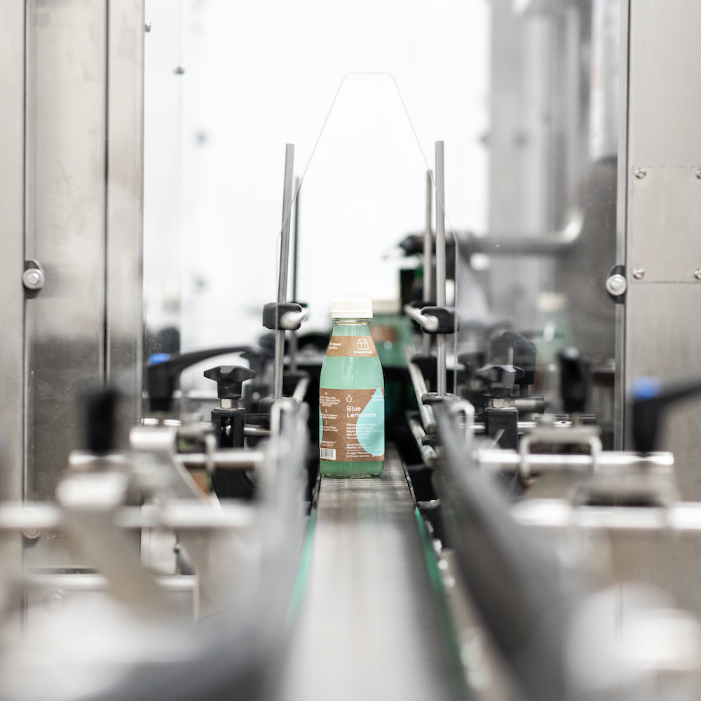 Bottle of juice in a factory